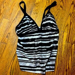 Black and white, halter style bathing suit top by Champion. Size Large (10-12)